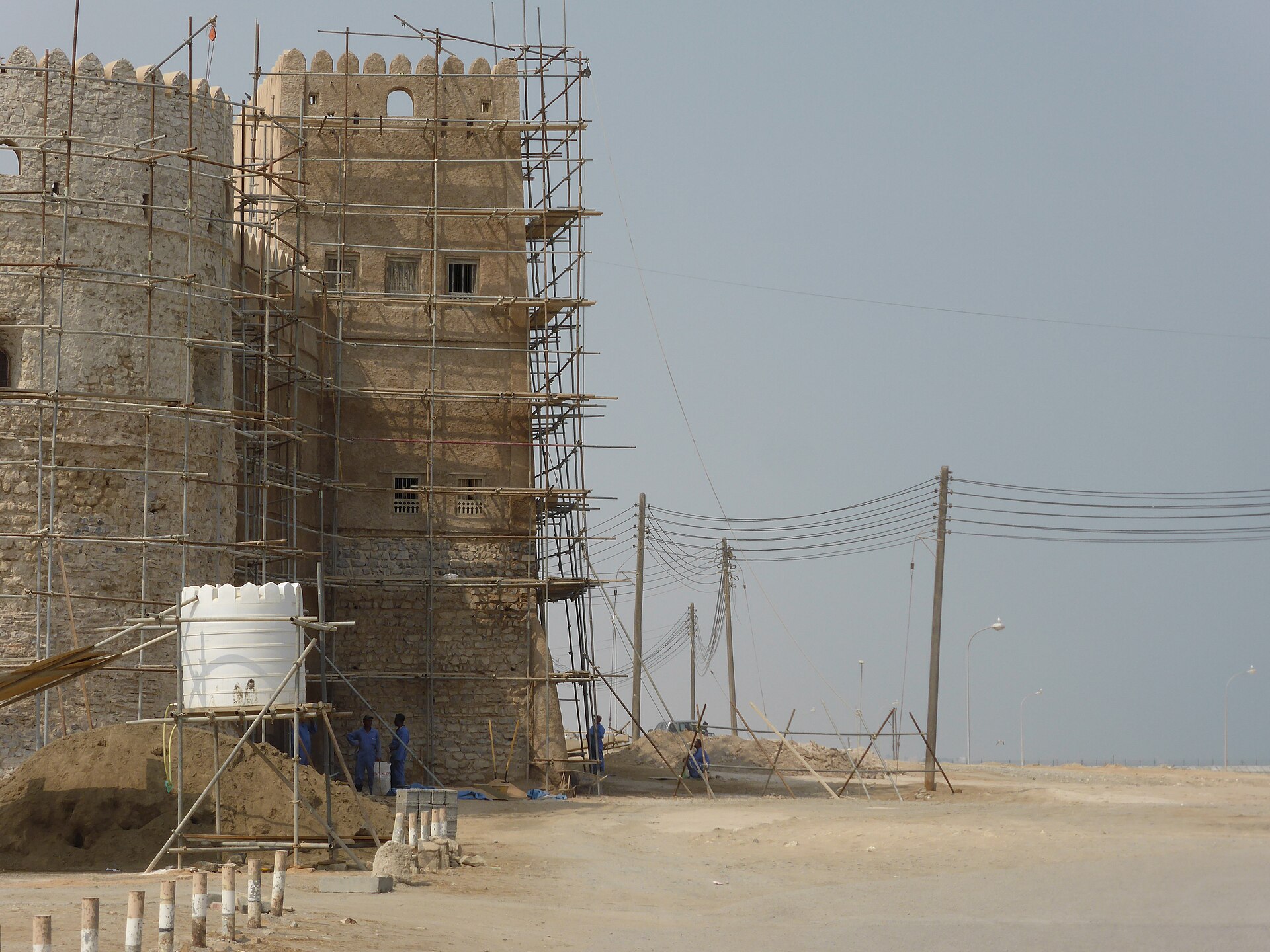 Barka Fort's crenellated coastal walls and cannon overlooking the sea