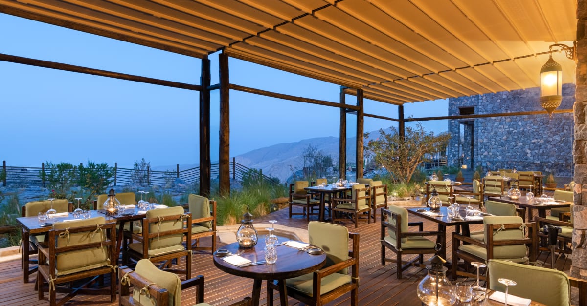 Juniper Restaurant terrace dining at Alila Jabal Akhdar with mountain views