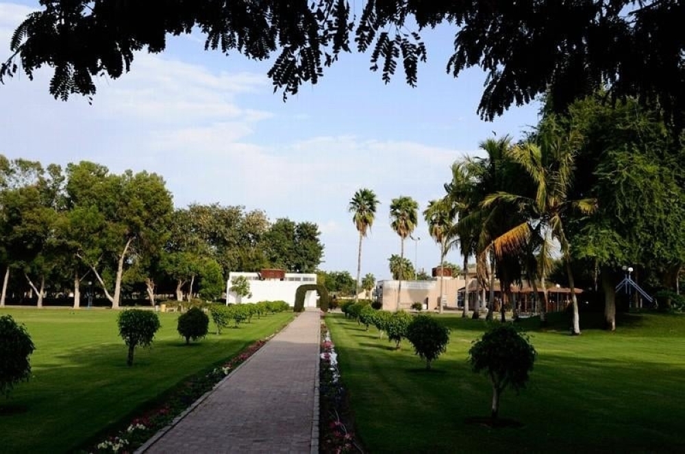 Green lawns and park landscaping at Naseem Garden in Barka