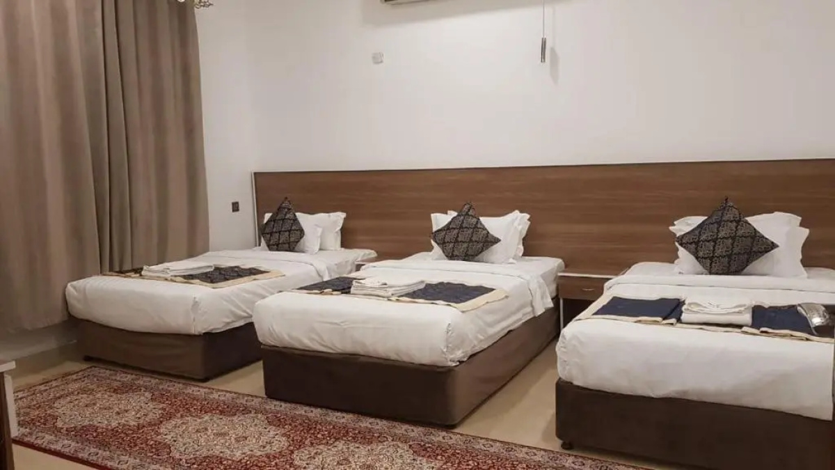 Family room with three beds at Orient Apartments, Nizwa