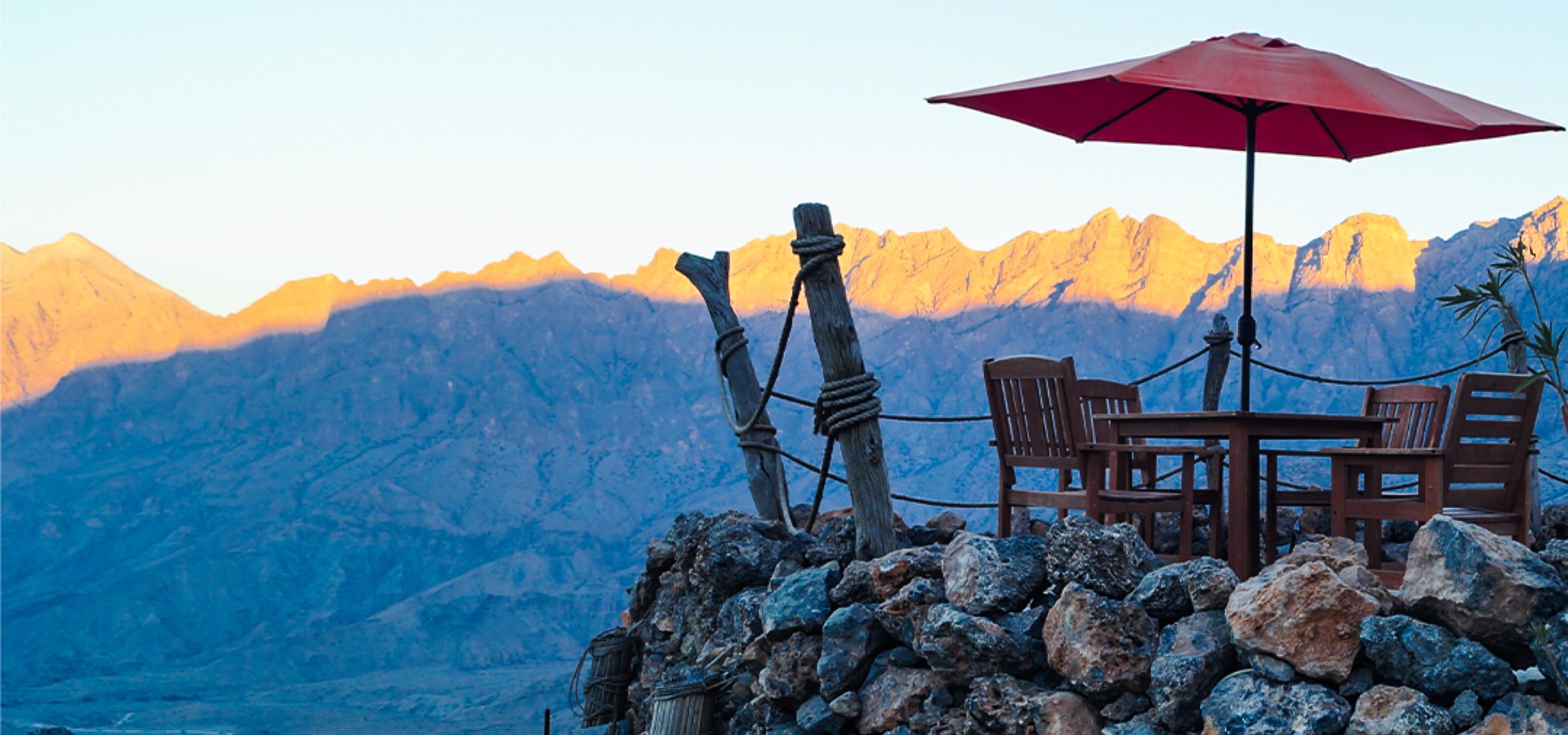Terrace seating at Sama Wakan Heritage Lodge looking across Wadi Mistal to the Western Hajar mountains