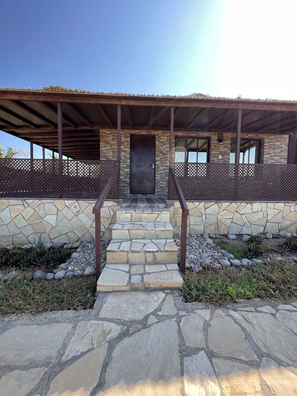 Barasti-roofed beach chalet at Turtle Beach Resort, Ras Al Hadd